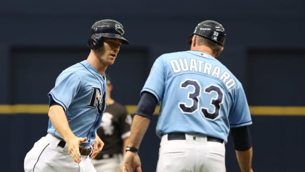 Aug 5, 2018; St. Petersburg, FL, USA; Tampa Bay Rays second baseman Joey Wendle (18) is congratulated by third base coach Matt Quatraro (33) as he hits a home run against the Chicago White Sox at Tropicana Field. Mandatory Credit: Kim Klement-USA TODAY Sports